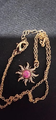 Customer photo review of Disney Princess Rapunzel Tangled Sun Opal Necklace