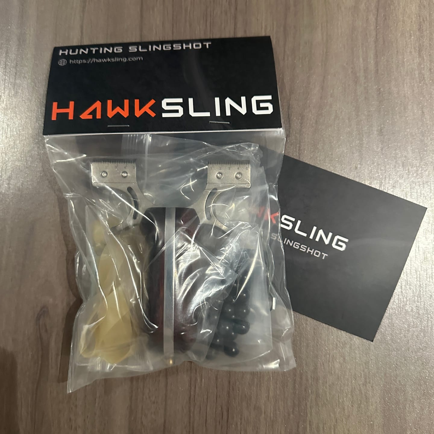 Customer photo review of Stainless Steel Wooden Handle Laser Hunting Slingshot II: Precision Redefined