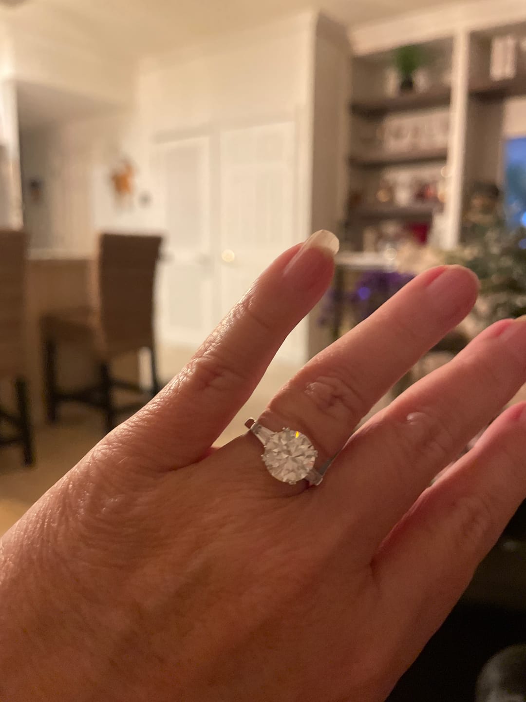 Customer photo review of Three Stone Round Moissanite Tapered Baguette Engagement Ring