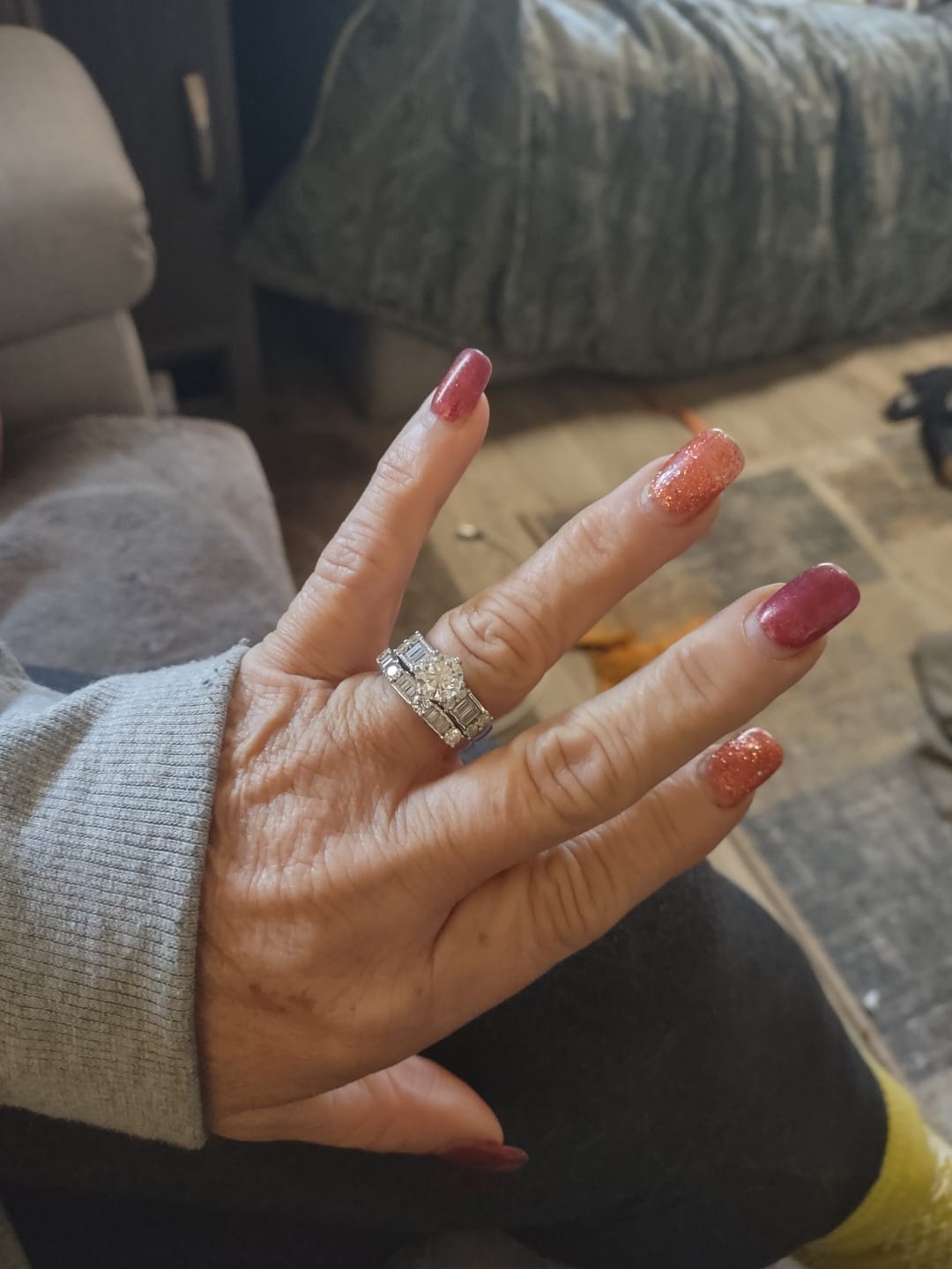 Customer photo review of Round Moissanite Emerald-Cut Side Stone Engagement Ring