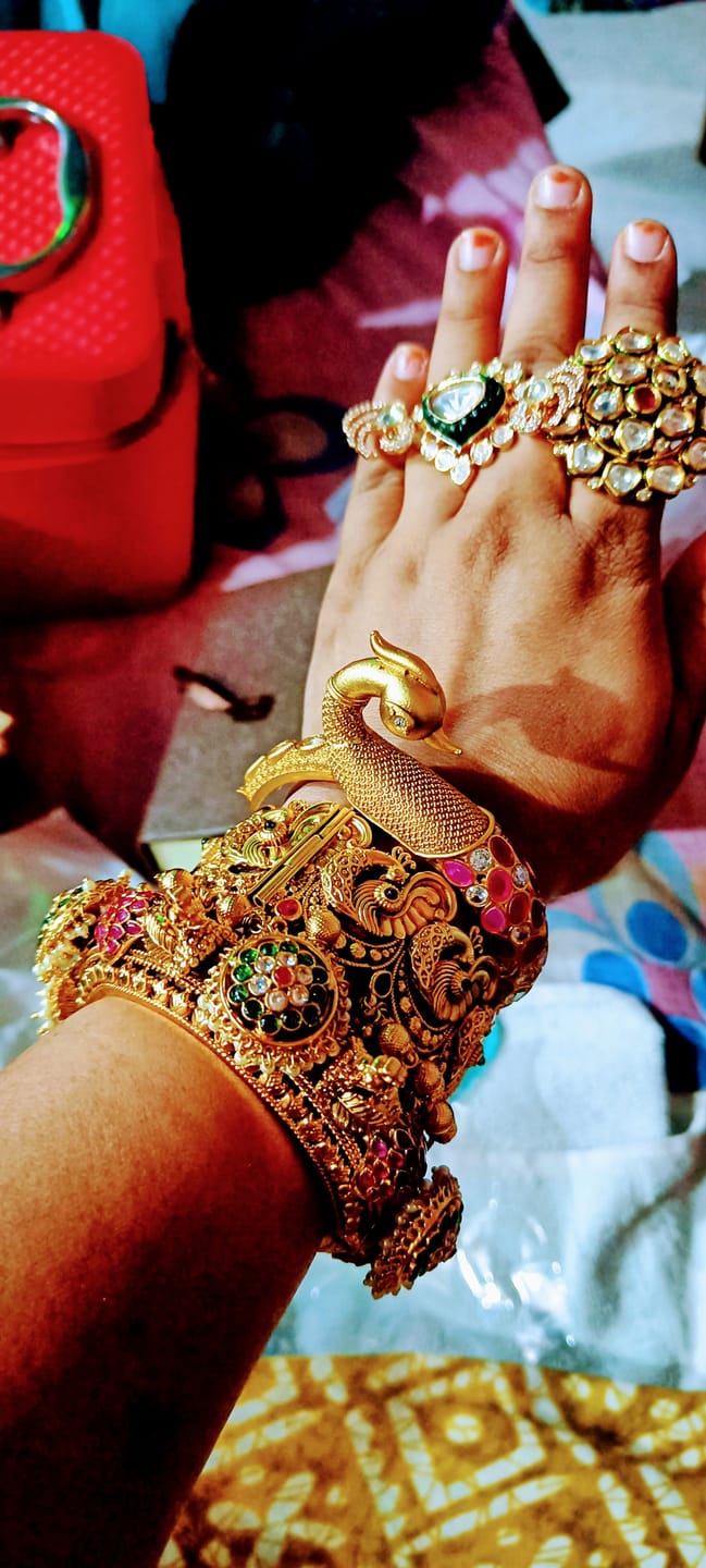 Customer photo review of Set of two openable kadas with peacocks and also kundan with green stone flower tukdies with pearly hangings