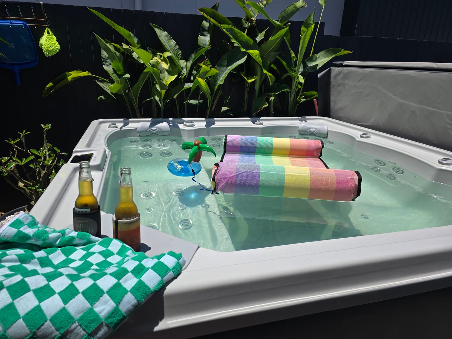 Customer photo review of Water Hammock - National Breast Cancer Foundation Partner with attachable waterproof phone sleeve and inflatable drink holder.