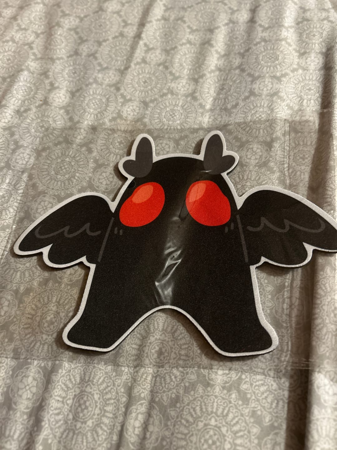 Customer photo review of Mothman Mouse Pad
