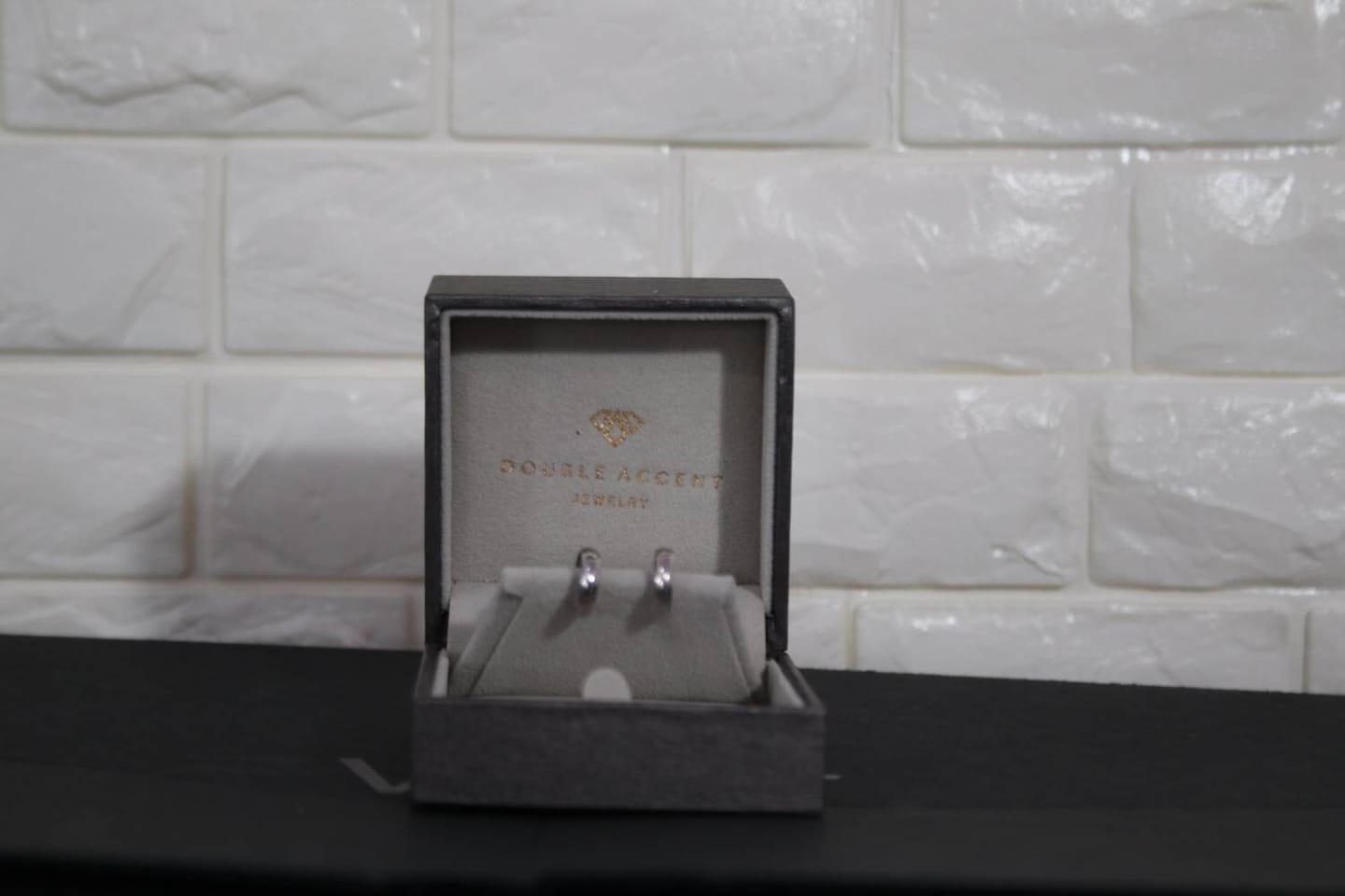 Customer photo review of Wide Dome Huggie Hoop Earrings, Solid 14K Gold