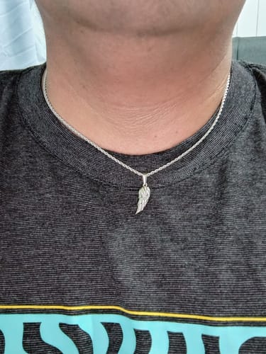 Reseña con foto de un cliente sobre Hermés Pendant