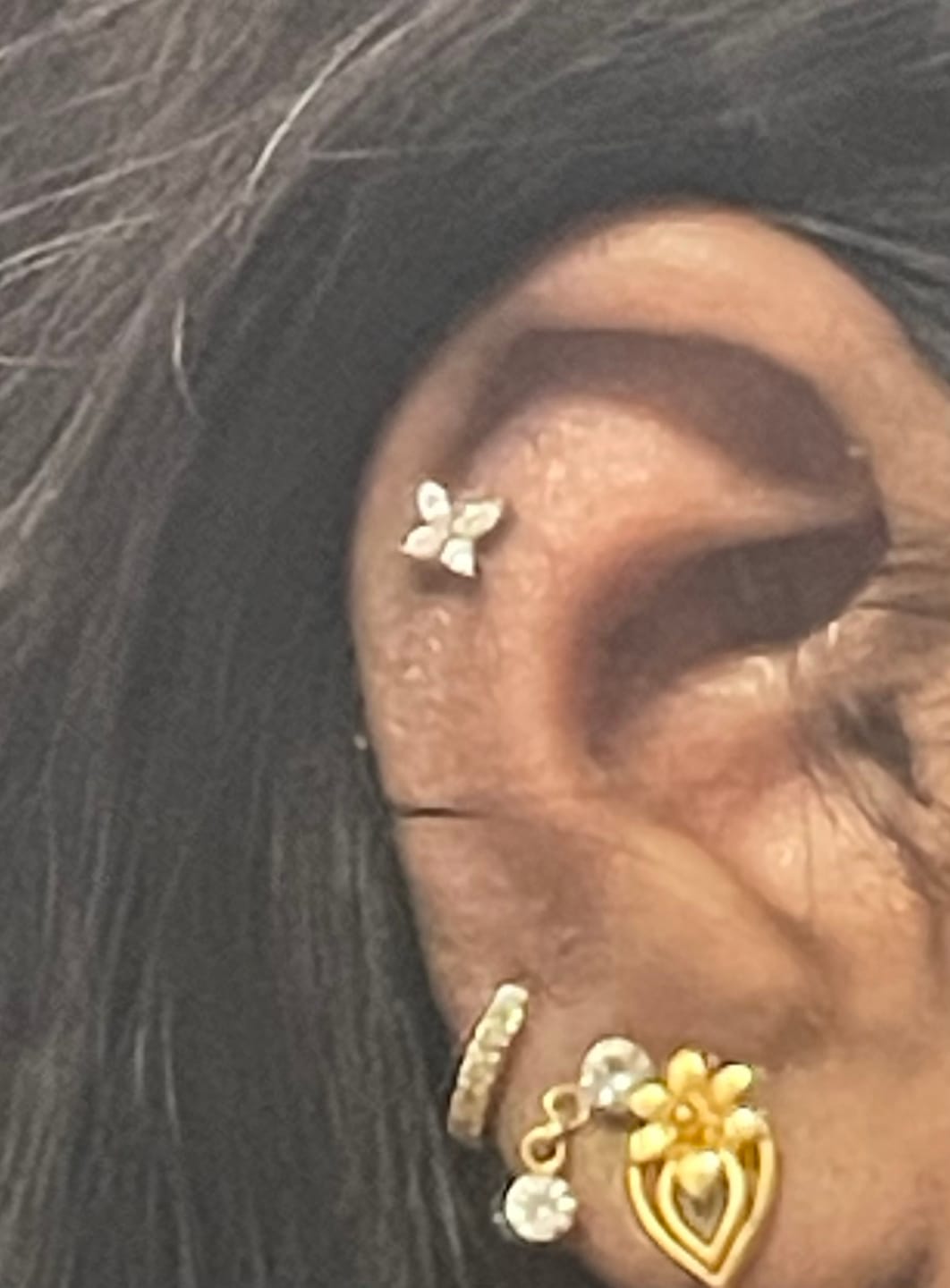 Customer photo review of Butterfly Piercing | Titan
