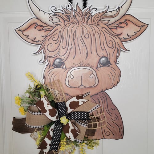 Customer photo review of Highland Cow Door Hanger, Cut Bow Holes, wood sign, DECOE-W-903436, 22" Door Hanger no