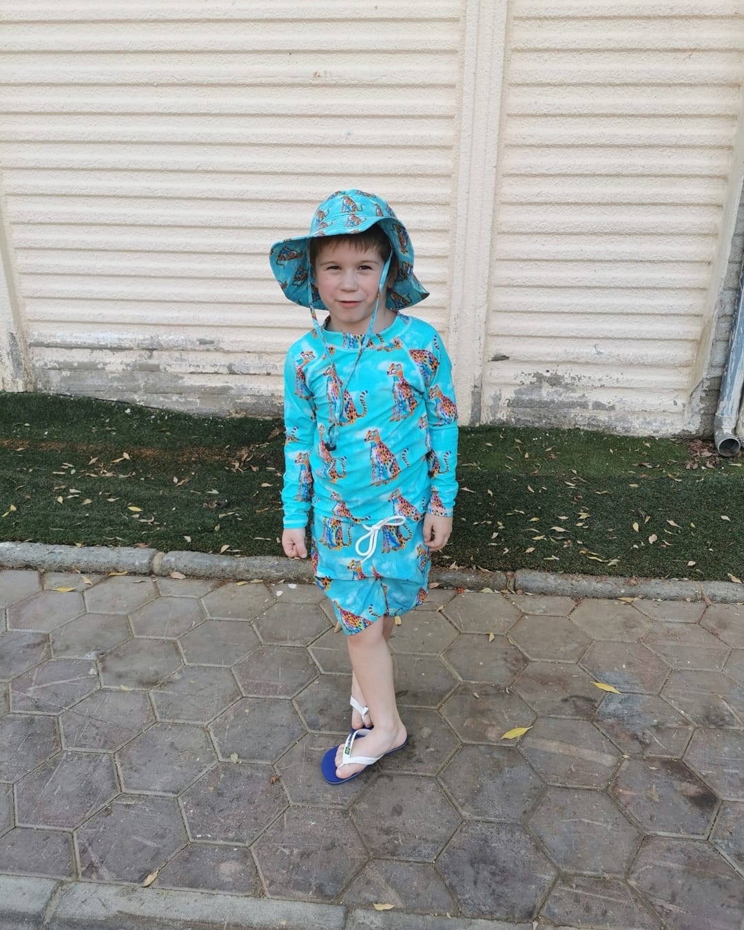 Customer photo review of Shimmering Cheetah Kids' Rash Top