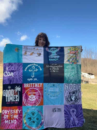 T-shirt quilt with dancing, travel themes by Brittney from PA