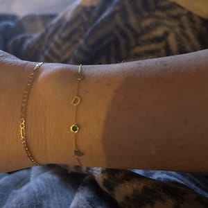 Customer photo review of 14K Solid Gold Paw Print Bracelet