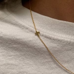 Customer photo review of Sideways Cross Necklace