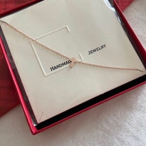 Customer photo review of Sideways Cross Necklace