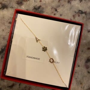 Customer photo review of Sideways Paw Letter Necklace