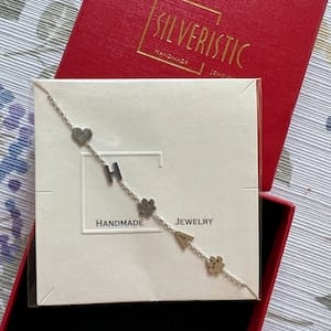 Customer photo review of Sideways Paw Letter Necklace