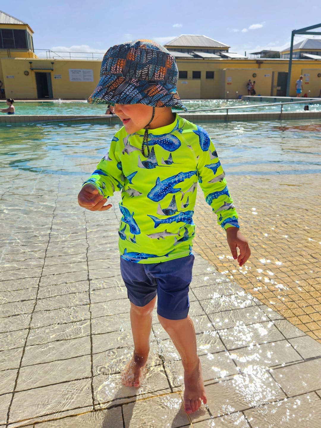 Customer photo review of Fluro Green Sharks Kids' Rash Top