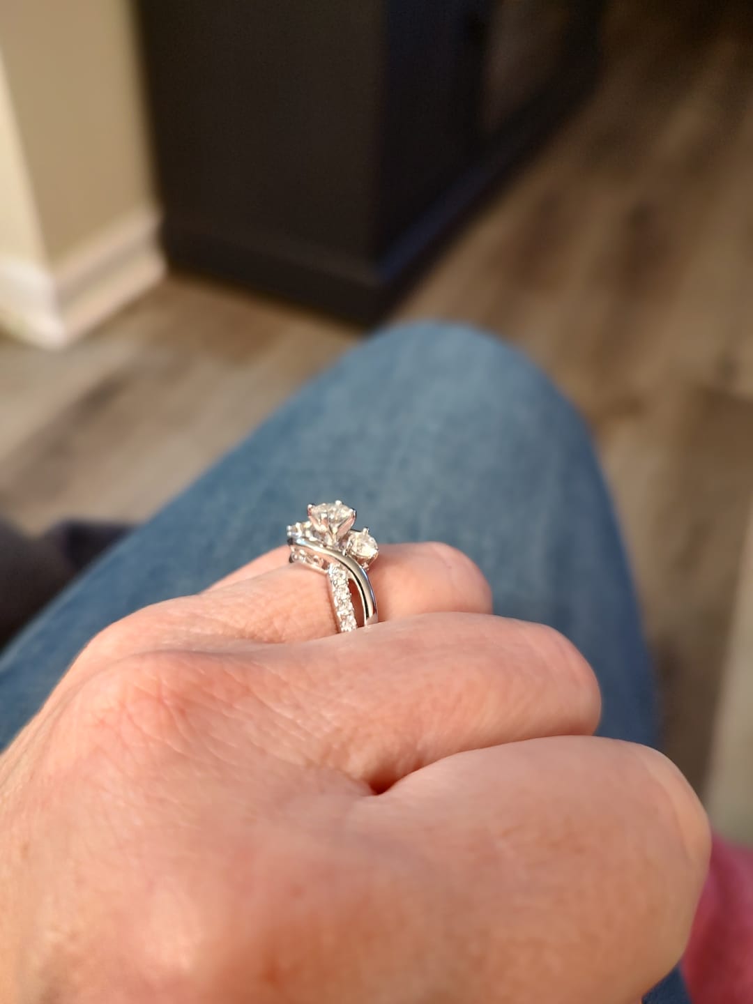 Customer photo review of Swirl Three Stone Moissanite Twisted Pave Engagement Ring