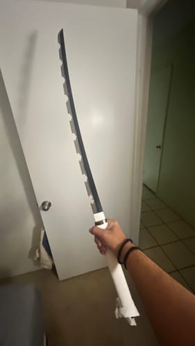 Customer photo review of Inosuke Hashibira’s  Katana 1045 Steel Blade Demon Slayer Sword Kimetsu No Yaiba Sword – Nichirin Sword