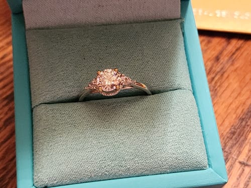 Customer photo review of Three Stone Moissanite Two Tone Halo Sterling Silver Ring