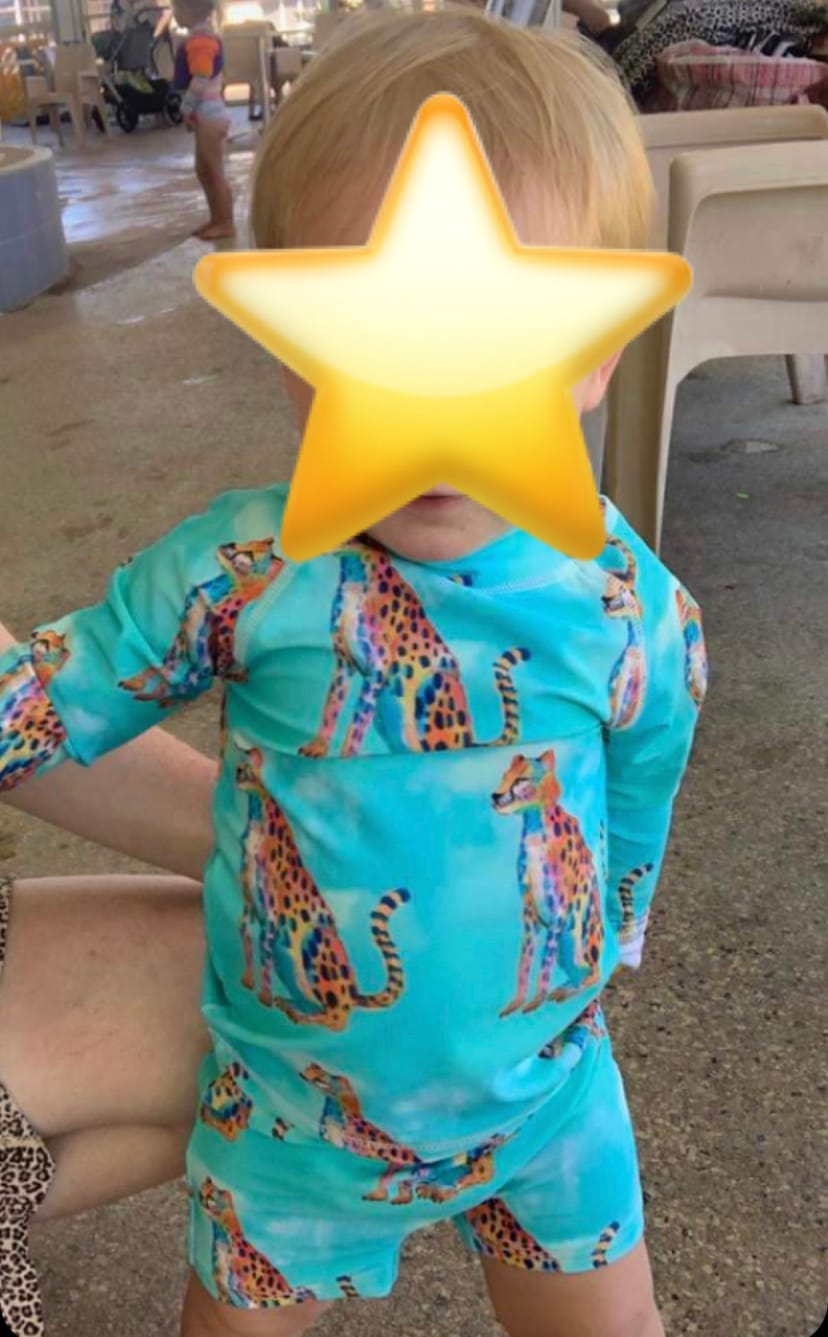 Customer photo review of Shimmering Cheetah Kids' Rash Top