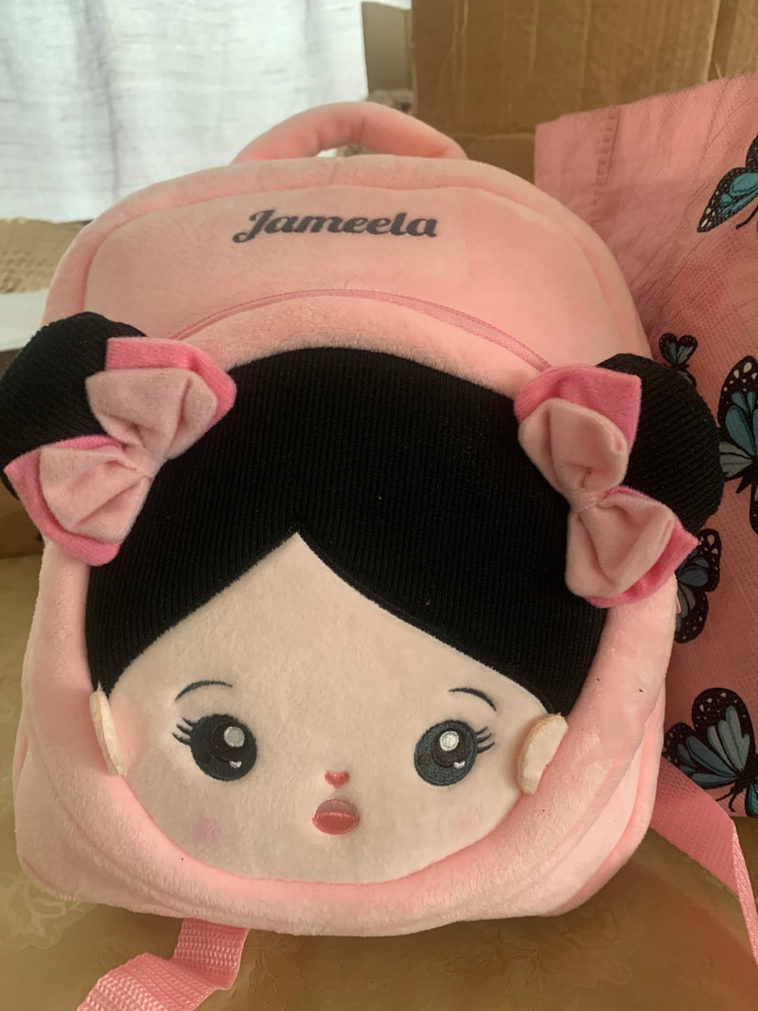 Customer photo review of Personalized Black Hair Pink Plush Baby Girl Backpack