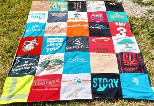 T-shirt quilt with community service, environmental awareness themes by Tami from FL