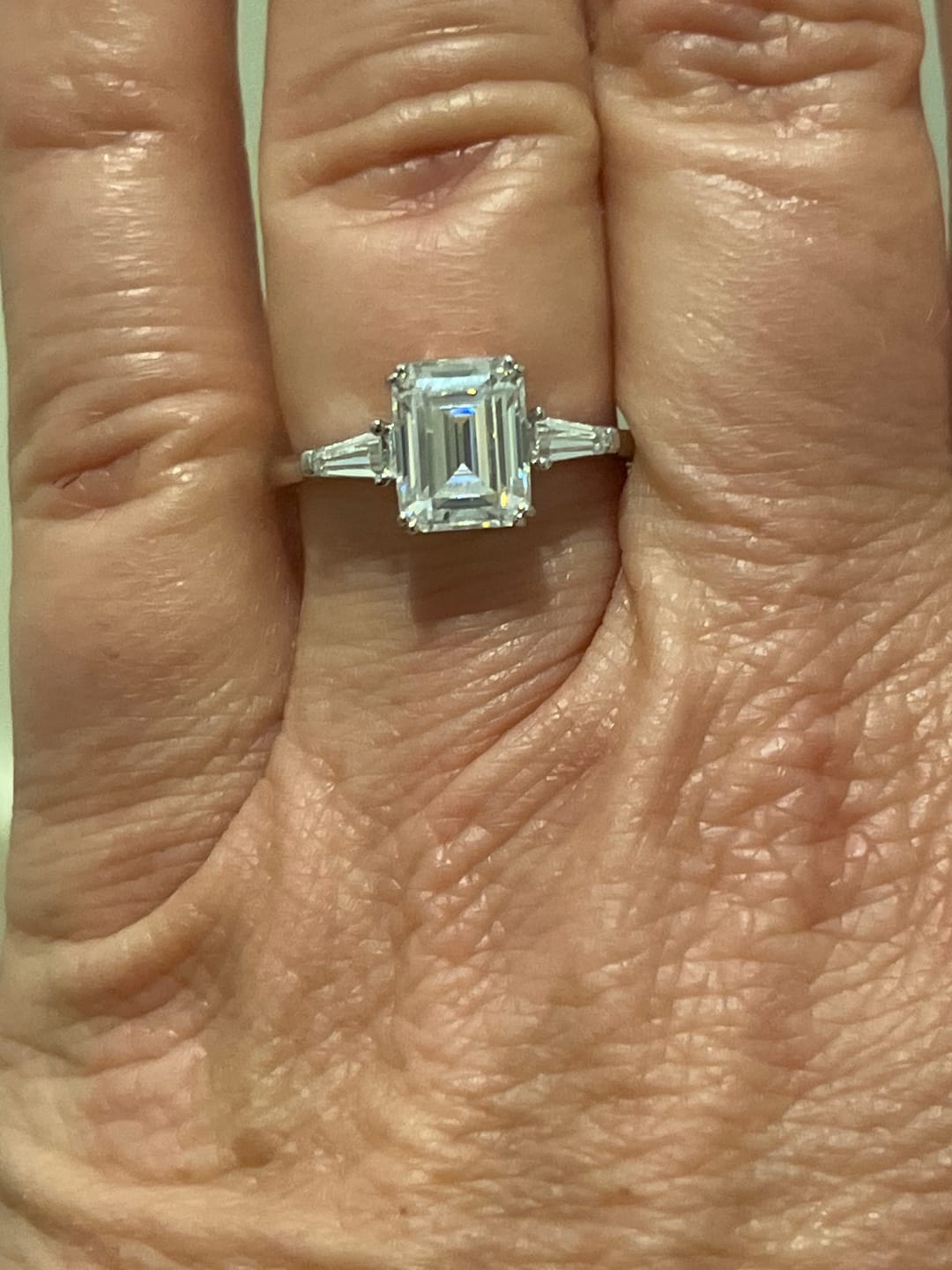 Customer photo review of Three Stone Emerald Cut Moissanite Tapered Baguette Engagement Ring