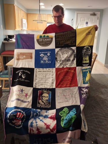 T-shirt quilt with camping, celebration themes by Laura from OR