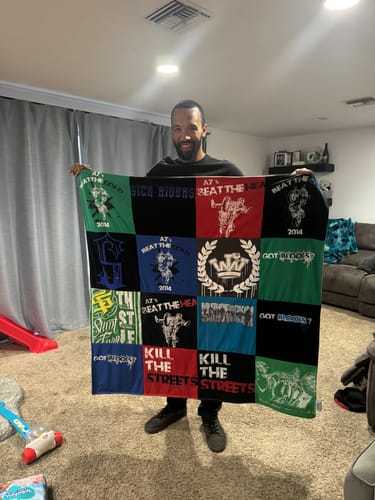 T-shirt quilt with community involvement, sports themes by Linda from AZ