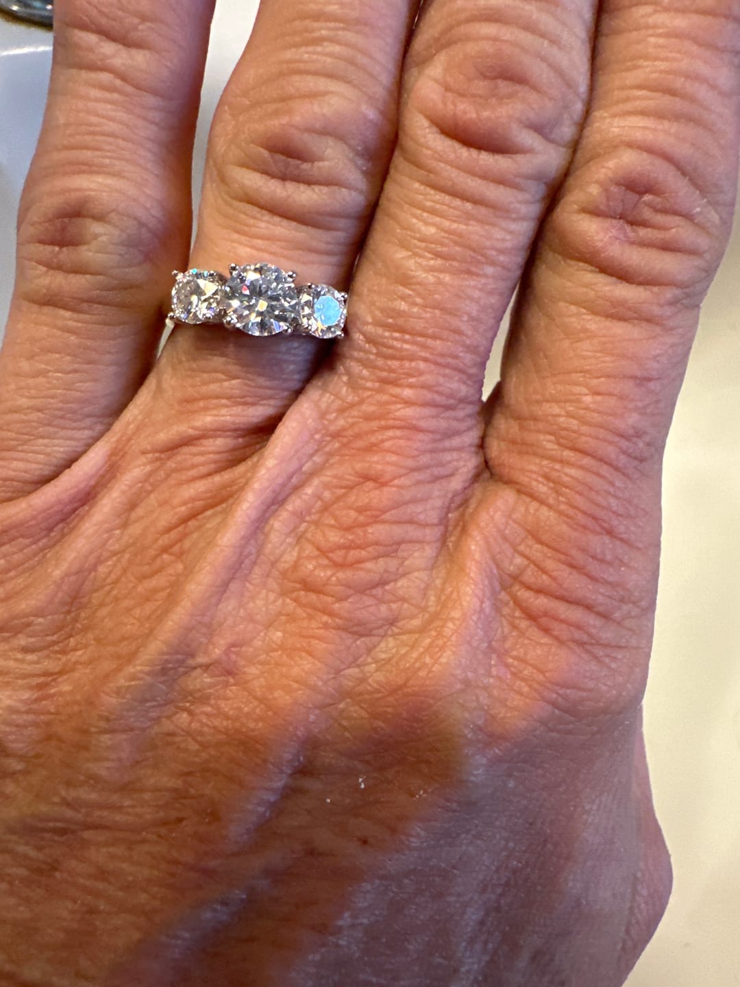 Customer photo review of Classic Three Stone Round Cut Moissanite Engagement Ring