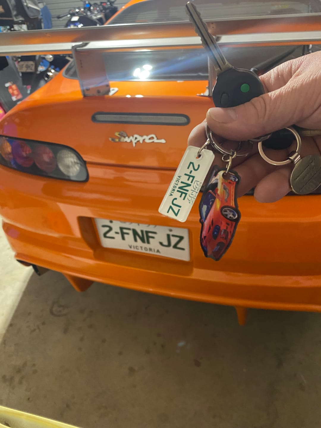 Customer photo review of PG Mini Custom Keychain