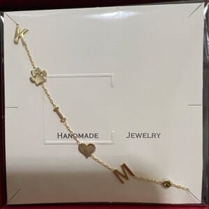 Customer photo review of Sideways Paw Letter Necklace