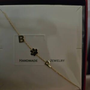 Customer photo review of Sideways Paw Letter Necklace