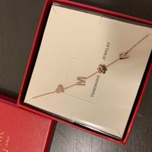 Customer photo review of Sideways Paw Letter Necklace