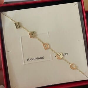 Customer photo review of Sideways Paw Letter Necklace