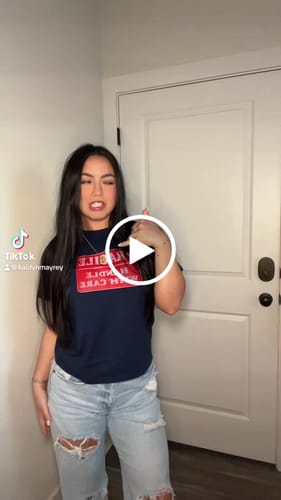 Customer video review of 'Fragile' baby tee