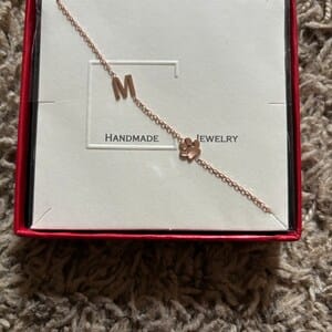 Customer photo review of Sideways Paw Letter Necklace