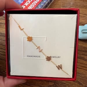 Customer photo review of Sideways Paw Letter Necklace