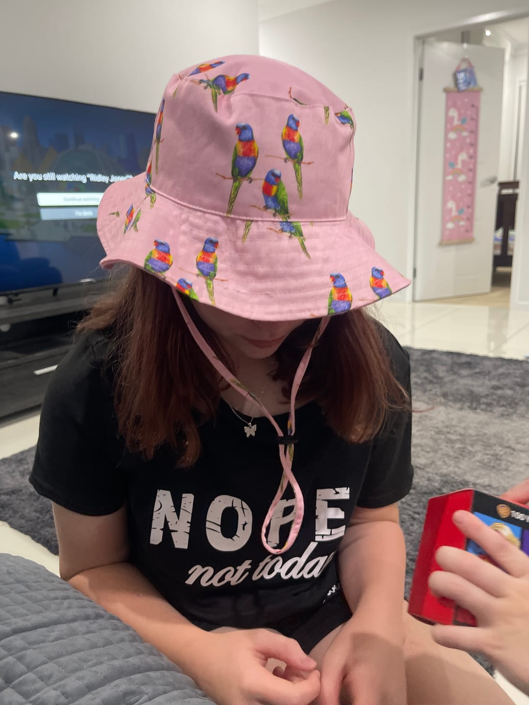 Customer photo review of Pink Rainbow Lorikeet Beach Hat