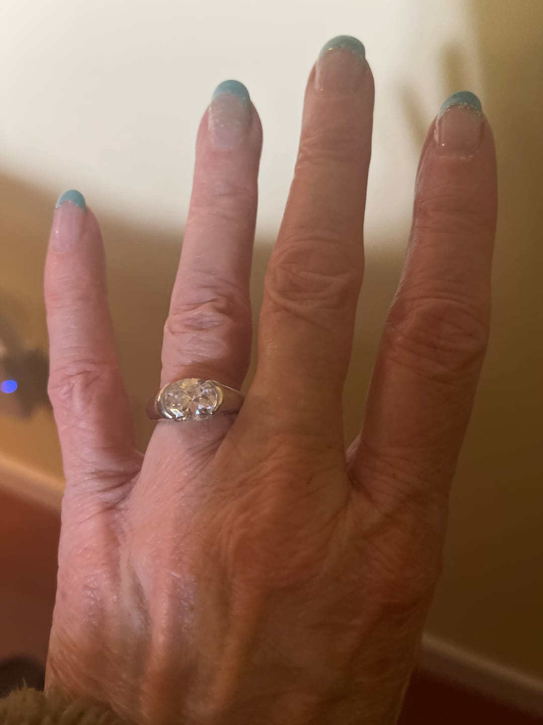 Customer photo review of Solitaire Oval Moissanite Half Bezel Set Engagement Ring