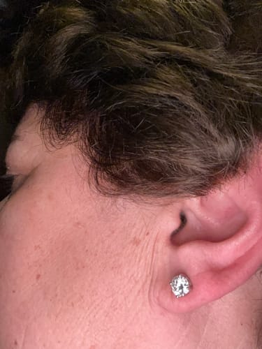 Customer photo review of Solitaire Round Moissanite Four Prong Sterling Silver Stud Earrings