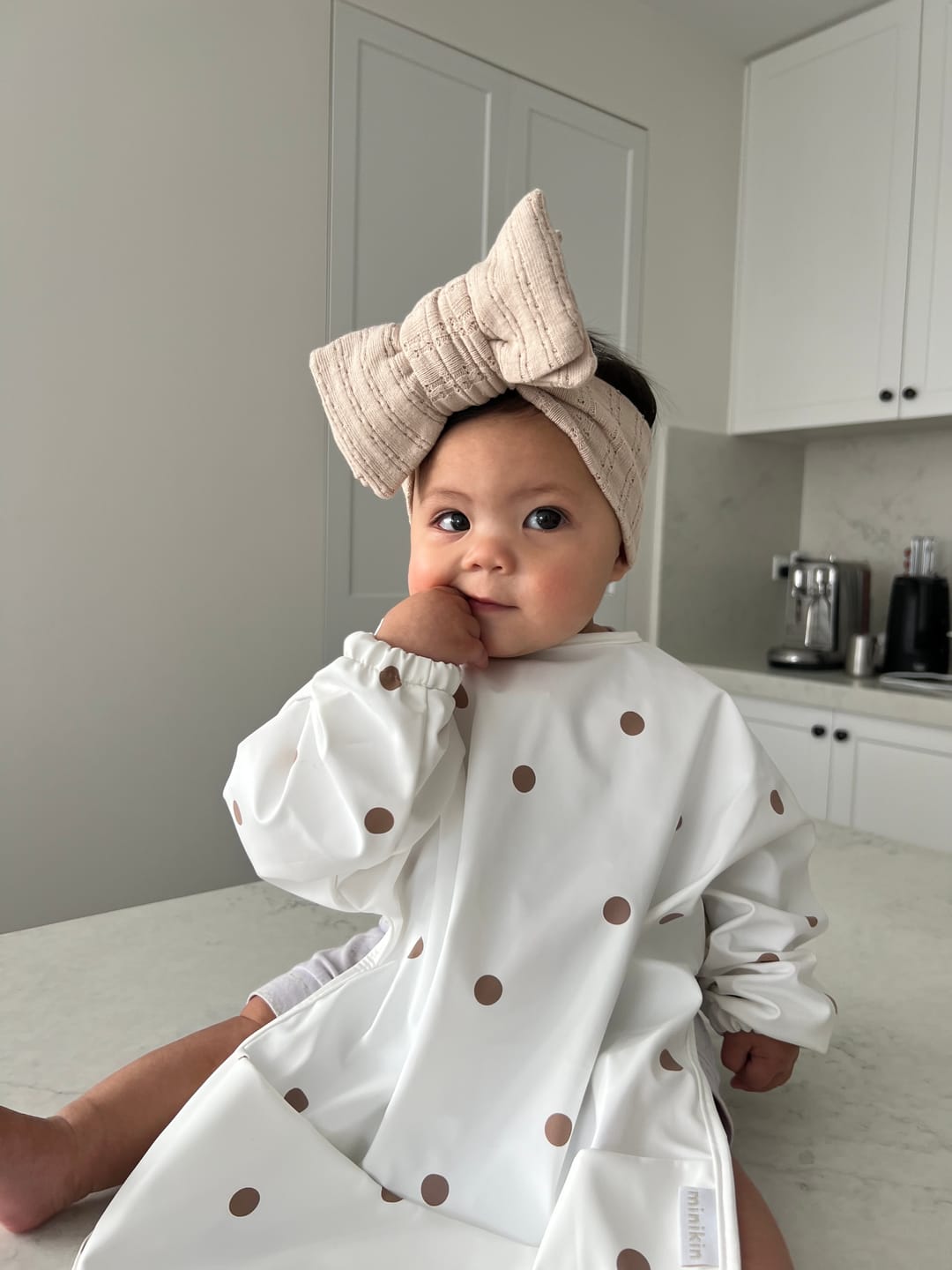 Customer photo review of Mess-Free Smock Bib | Brown Polka Dot