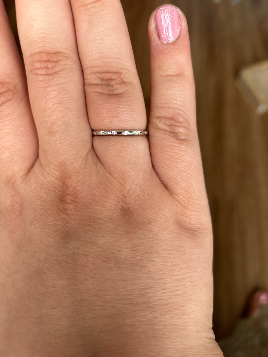Customer photo review of Flush Set Moissanite Evenly Spaced Eternity Wedding Band
