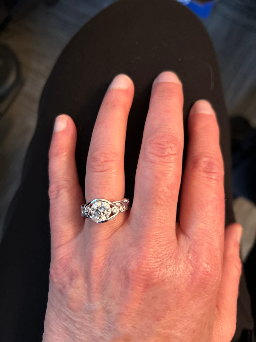 Customer photo review of Bezel Set Round Moissanite Scroll Accents Engagement Ring