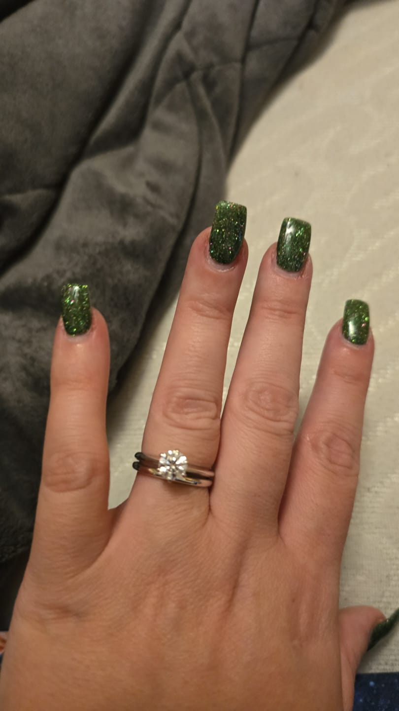 Customer photo review of Classic Solitaire Moissanite Six-Prong Sterling Silver Engagement Ring