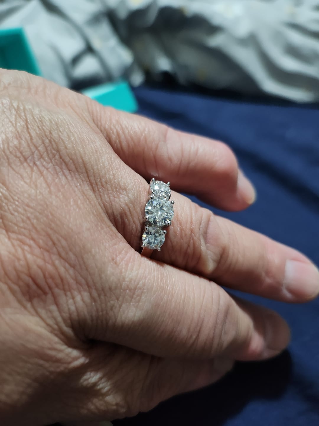 Customer photo review of Classic Three Stone Round Cut Moissanite Engagement Ring