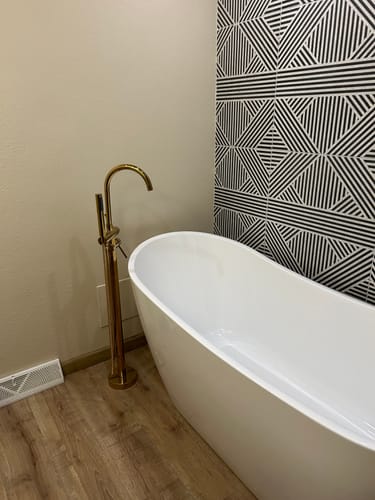 Customer photo review of Unlacquered Solid Brass Tub Filler and Handheld Standing Two Outlets Bathtub Faucet