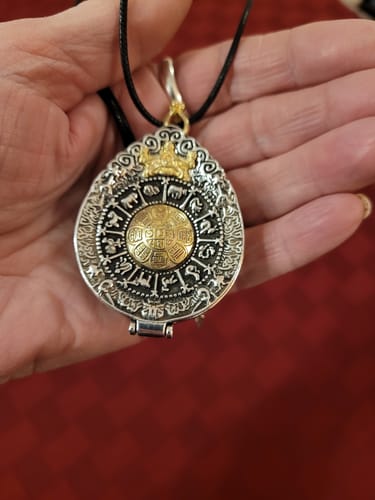 Customer photo review of Tibetan Manifestation Ghau Amulet