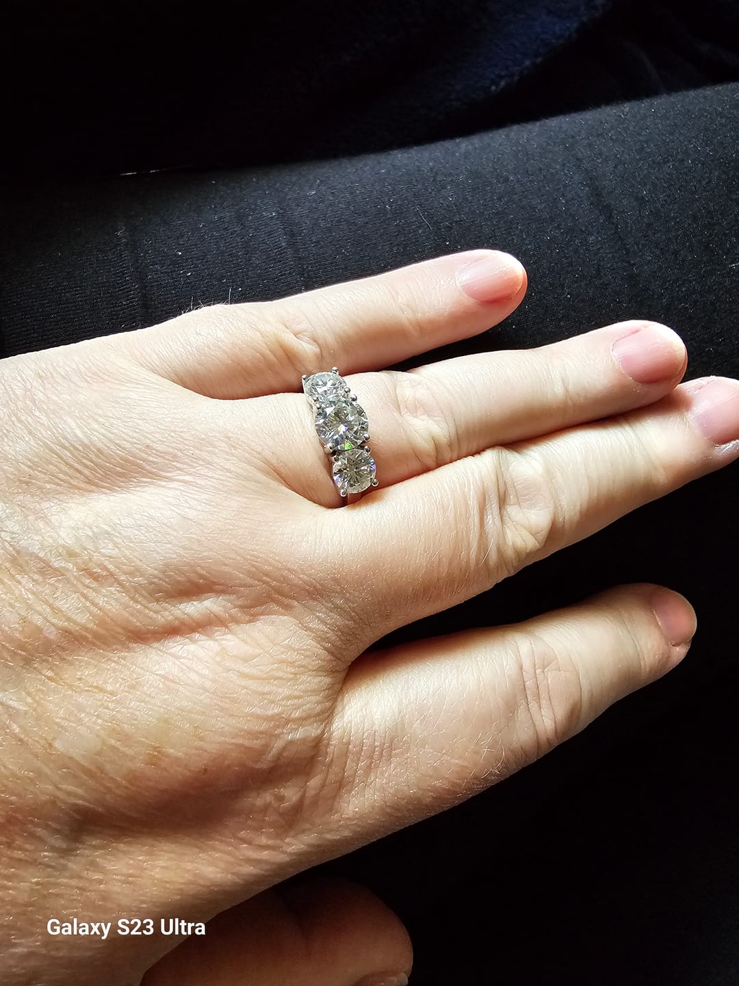Customer photo review of Classic Three Stone Round Cut Moissanite Engagement Ring