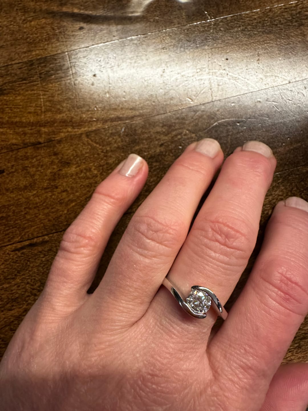 Customer photo review of Solitaire Tension Set Moissanite Bypass Engagement Ring
