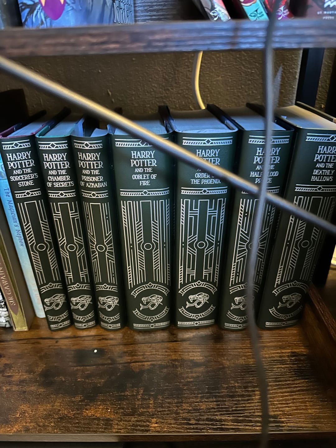 Customer photo review of *Imperfect* Harry Potter Foil Slytherin Dust Jackets
